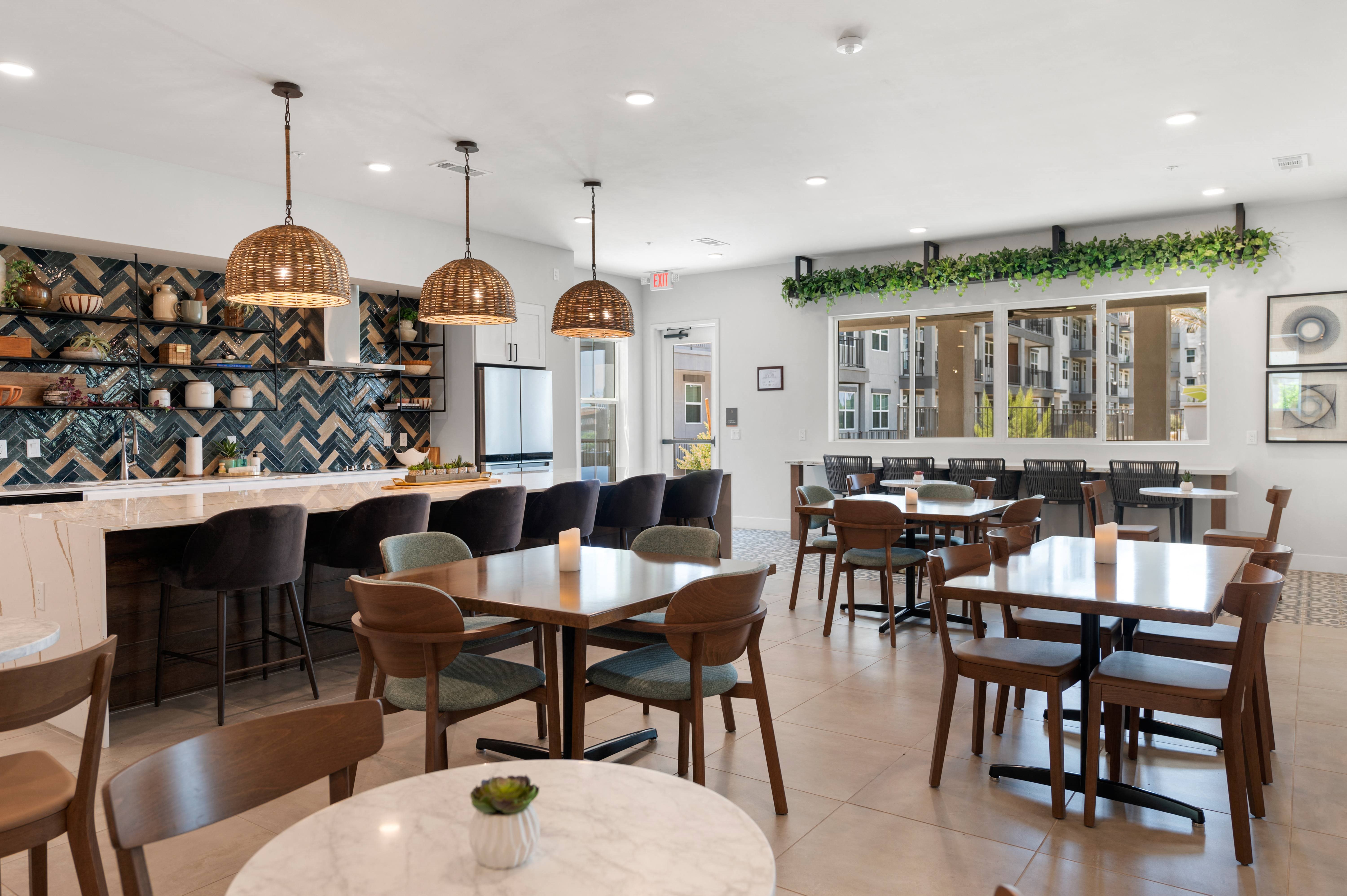 clubhouse dining room with tables and chairs and a bar